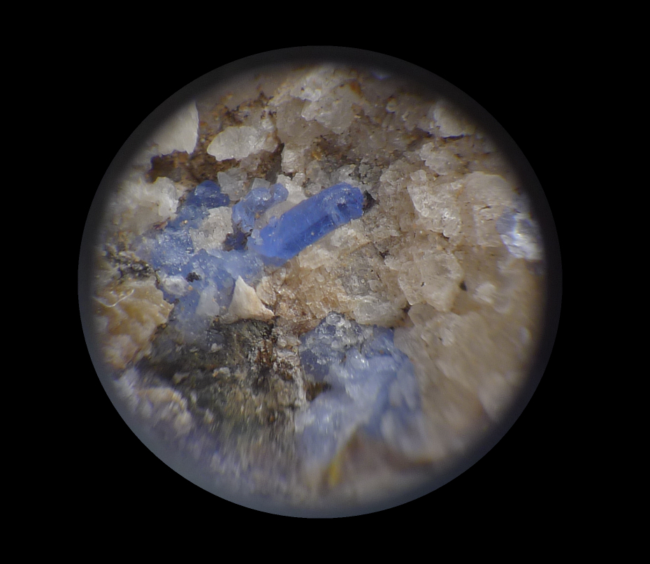 Blue willemite, center crystal is 2 mm in length.