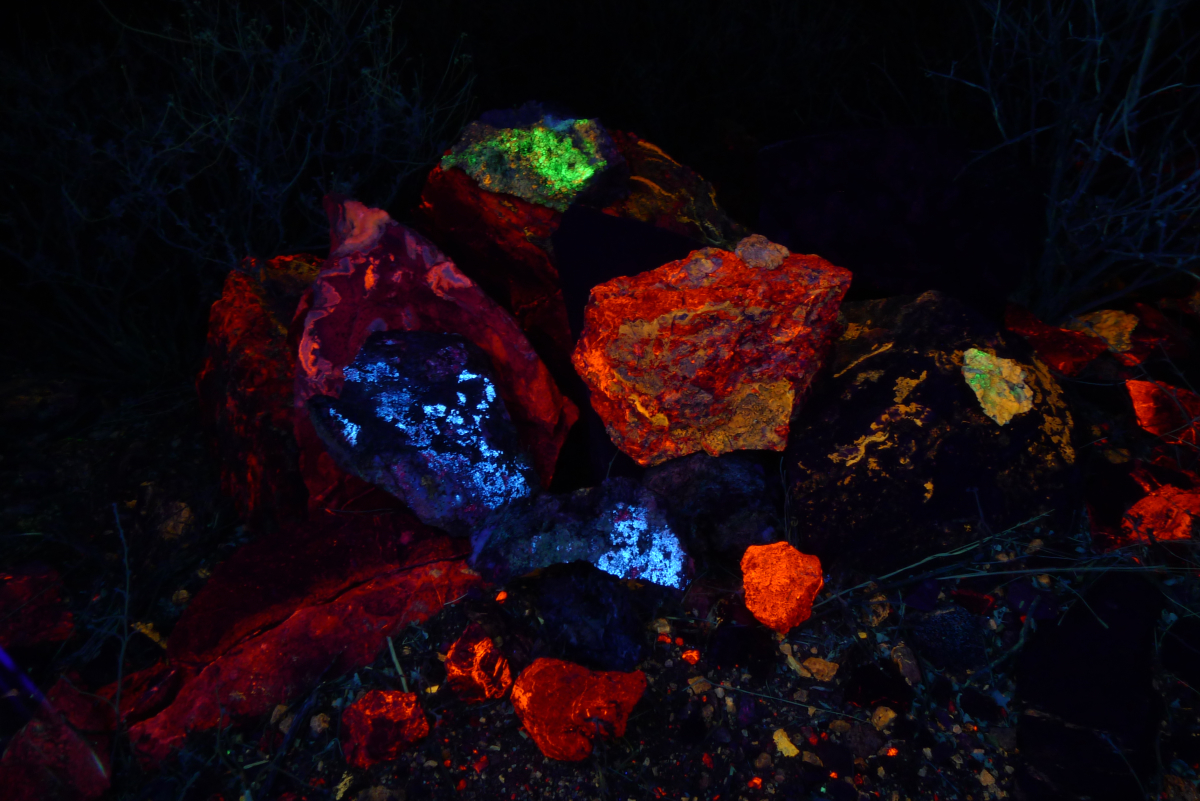 Orange calcite, green hyalite, yellow aragonite, and blue/white hydrozincite under shortwave light