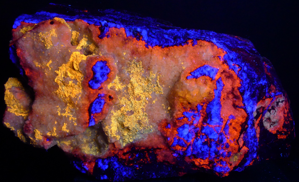 Blue fluorite, orange/white calcite, yellow caliche; short/longwave; 25 cm